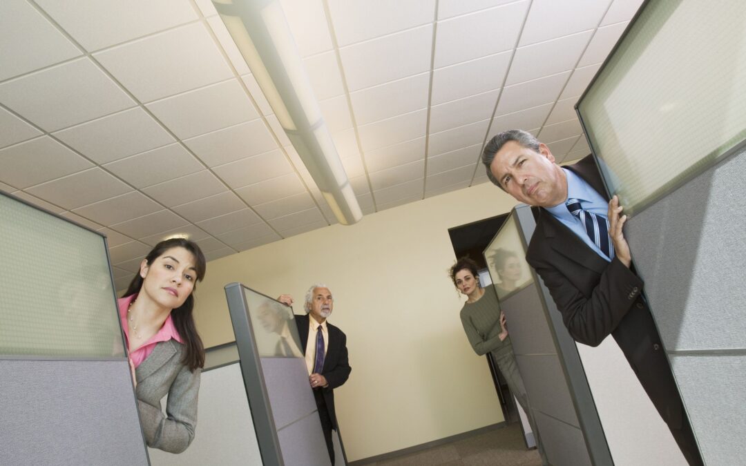 35544319 – businesspeople peeking out of office cubicles